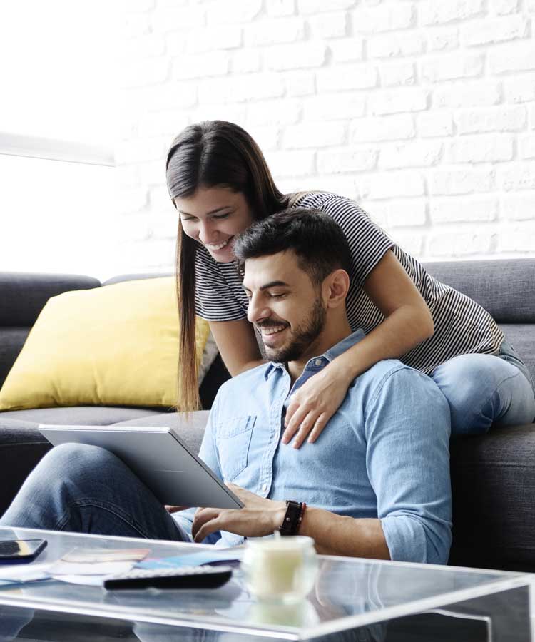 People on a tablet smiling happily